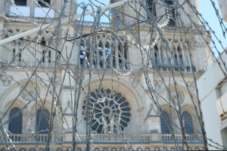 wires in front of notre dame cathedral in paris during the restoration